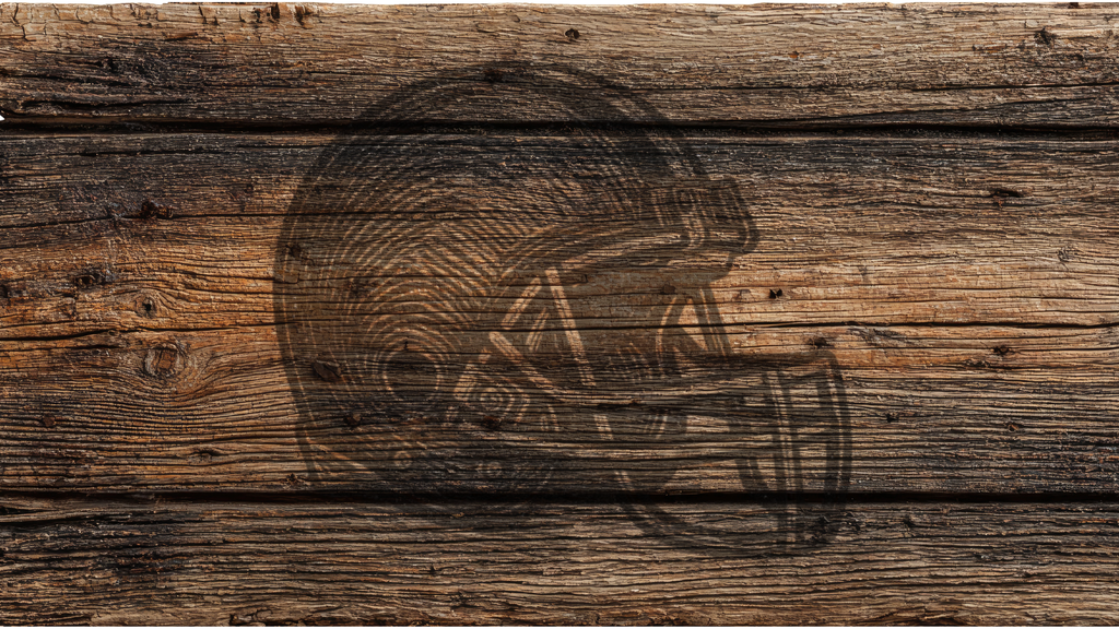 A rustic engraved design of a football helmet on weathered brown wooden planks.