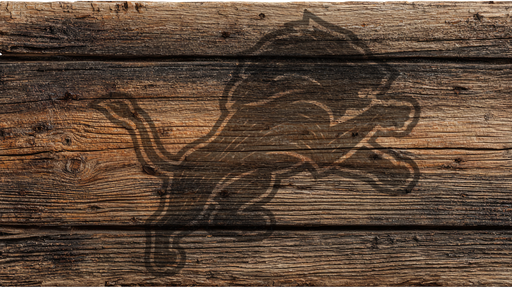 A rustic brown wooden plank surface with a dark engraved or burned lion logo across the center.