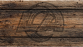 Rustic dark brown wooden planks background with a faint circular logo watermark overlay.