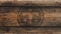 Rustic brown wooden plank background with visible grain, knots, and a faint circular logo watermark in the center.